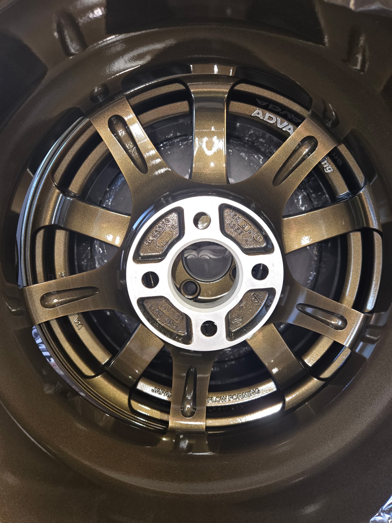 Bronze two-tone ADVAN racing wheel powder coated — custom finish NWI