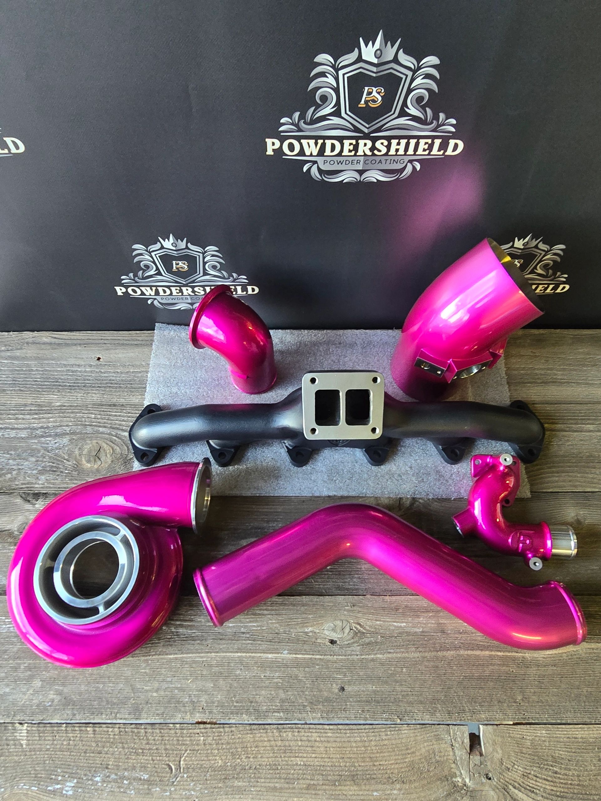 Automotive turbo parts in hot pink powder coat